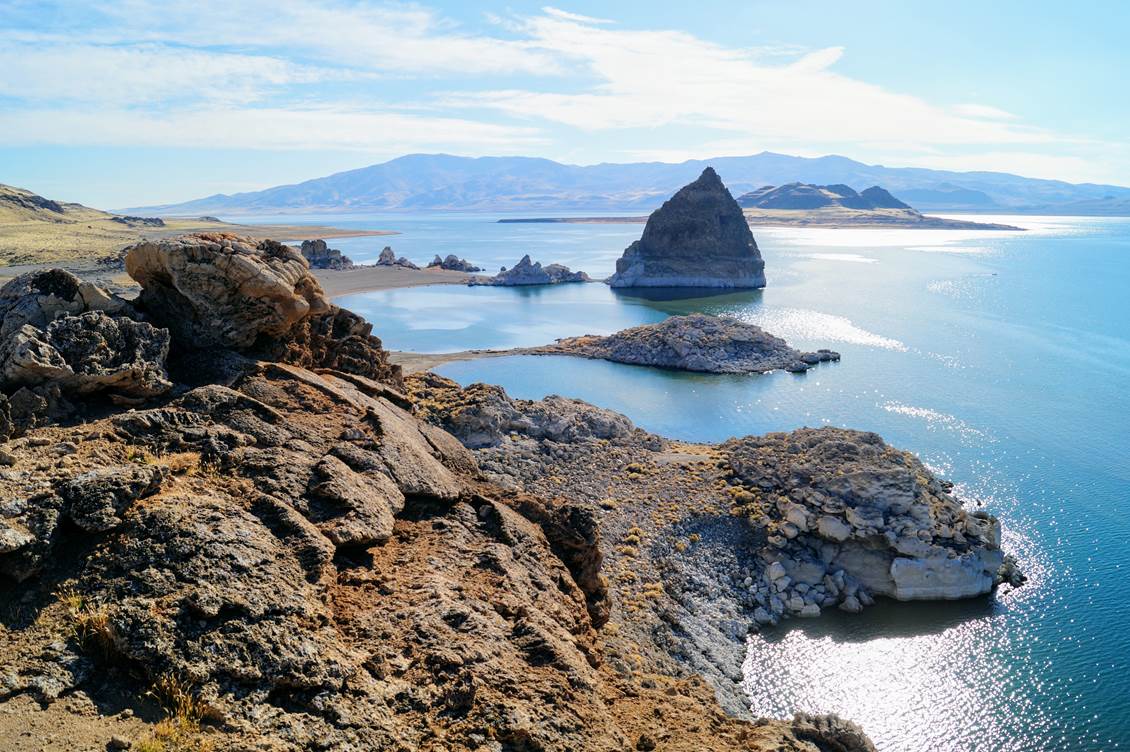 lake surrounded by rocky outcrops